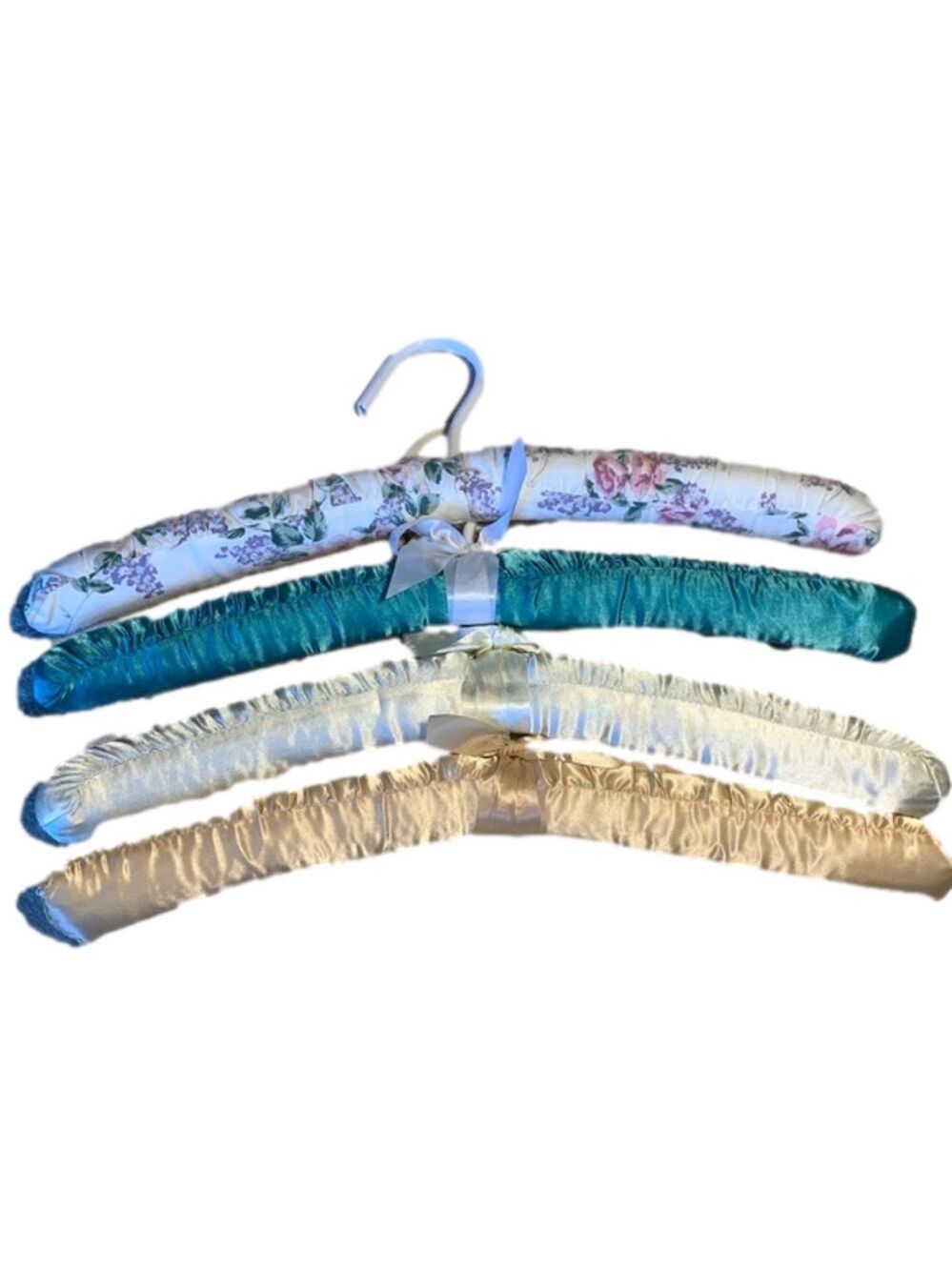 Four fabric covered hangers